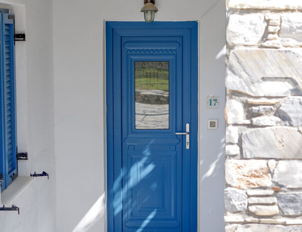 blue door on white walls